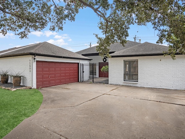 ranch-style house featuring a garage