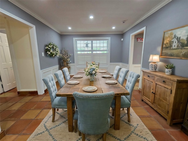 tiled dining room featuring crown molding