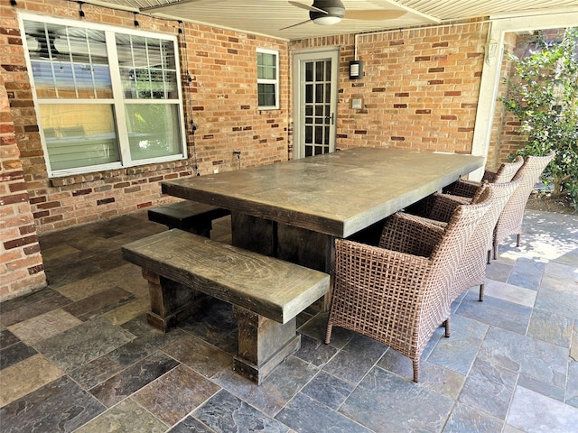 view of patio / terrace featuring ceiling fan and an outdoor bar