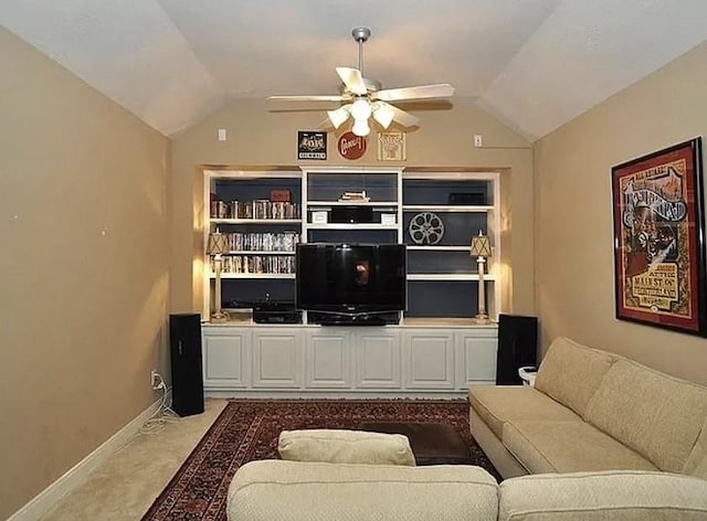 carpeted living room with vaulted ceiling and ceiling fan