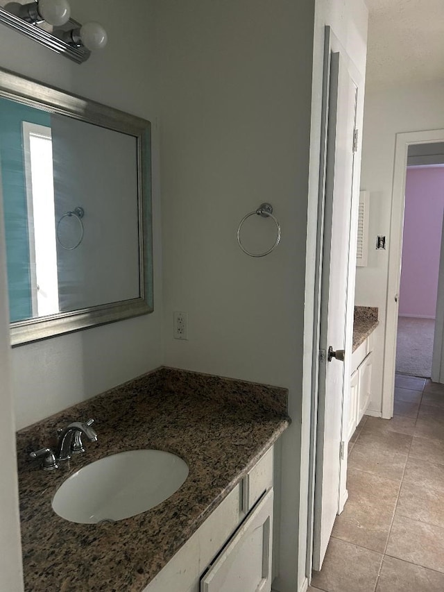 bathroom featuring tile patterned floors and vanity