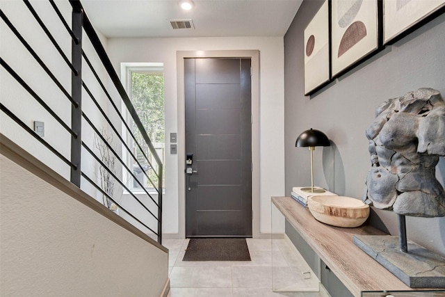 foyer featuring light tile patterned floors