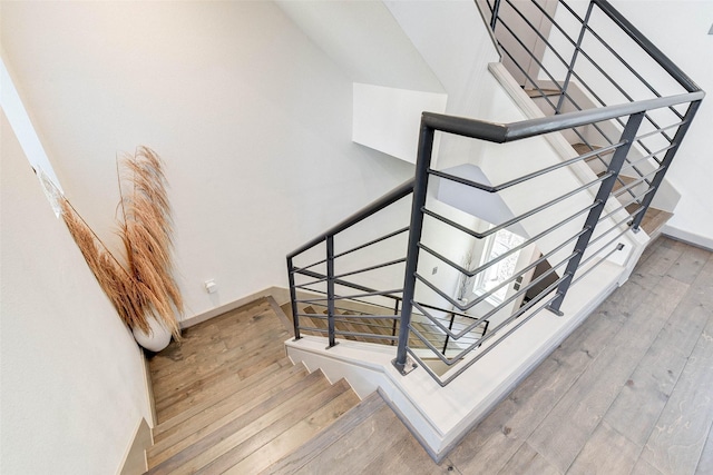 stairway featuring hardwood / wood-style floors