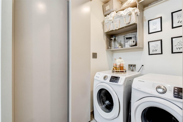 laundry room featuring washing machine and dryer