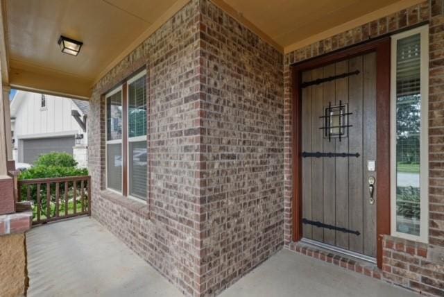 doorway to property with a porch