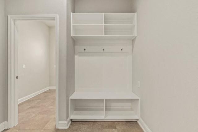 mudroom with light tile patterned floors