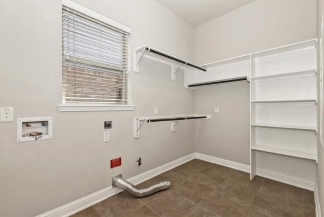 clothes washing area with electric dryer hookup, gas dryer hookup, and hookup for a washing machine