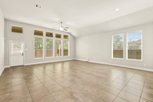 unfurnished living room featuring ceiling fan, light tile patterned floors, and lofted ceiling