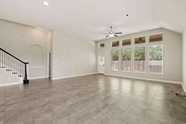 unfurnished living room with ceiling fan, light tile patterned flooring, and lofted ceiling