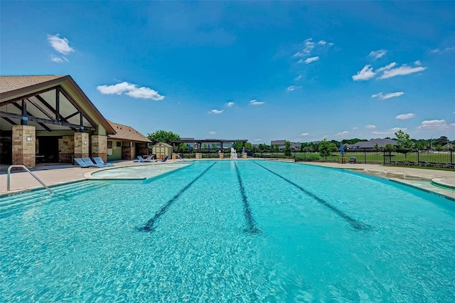 view of swimming pool featuring a patio area