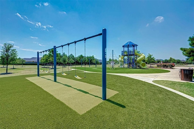 view of property's community featuring a playground and a lawn