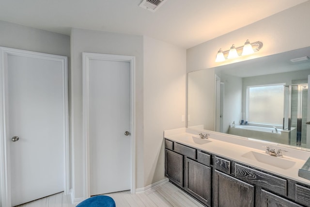 bathroom with vanity and plus walk in shower