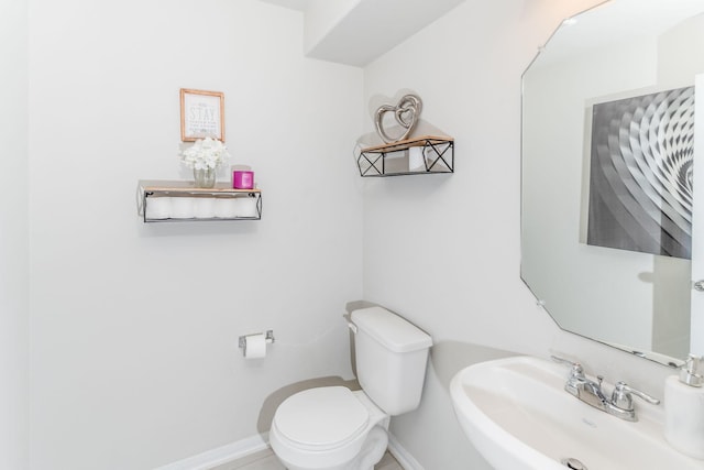 bathroom with toilet and sink