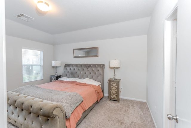 bedroom with light colored carpet