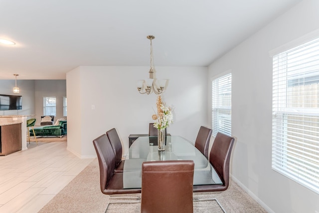 dining space featuring a chandelier