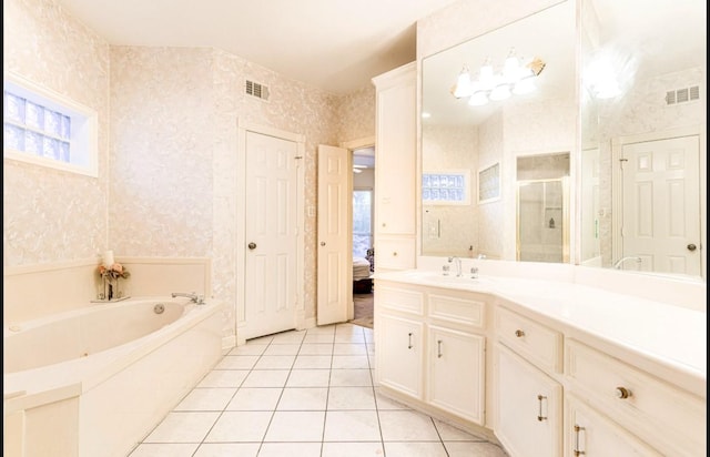 bathroom with vanity, tile patterned floors, and separate shower and tub