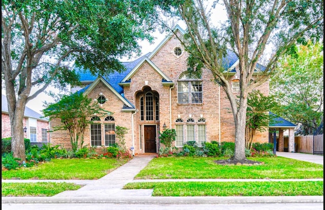 front facade with a front lawn