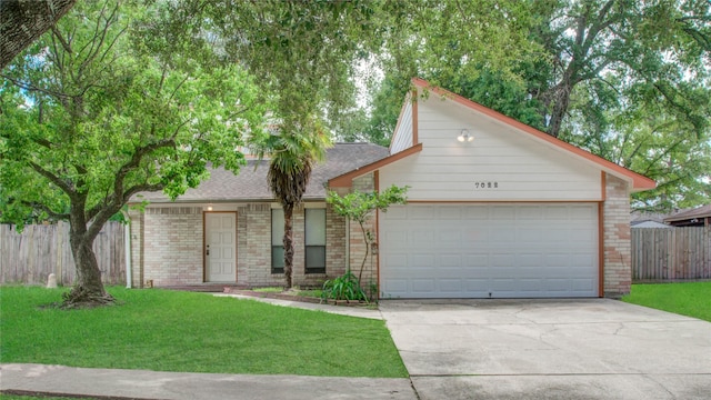 ranch-style house featuring a garage and a front lawn