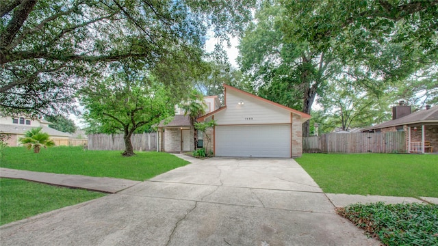 view of front facade featuring a front yard and a garage