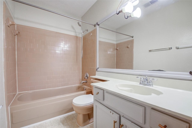 full bathroom with vanity, toilet, and tiled shower / bath