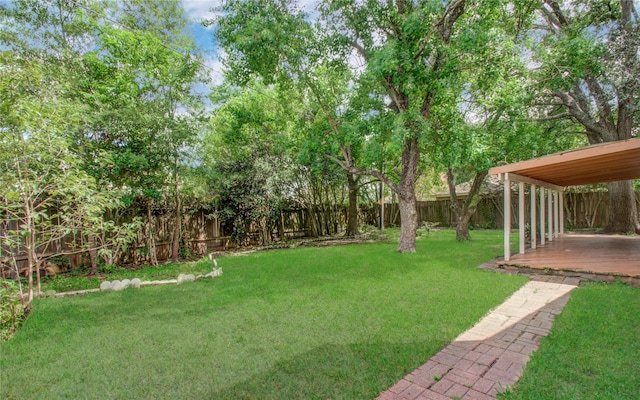 view of yard with a deck