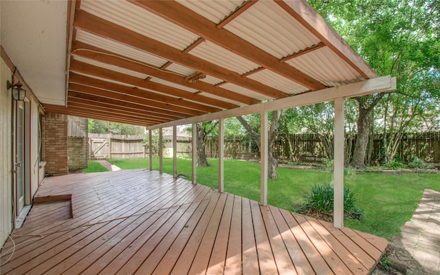 wooden terrace with a lawn