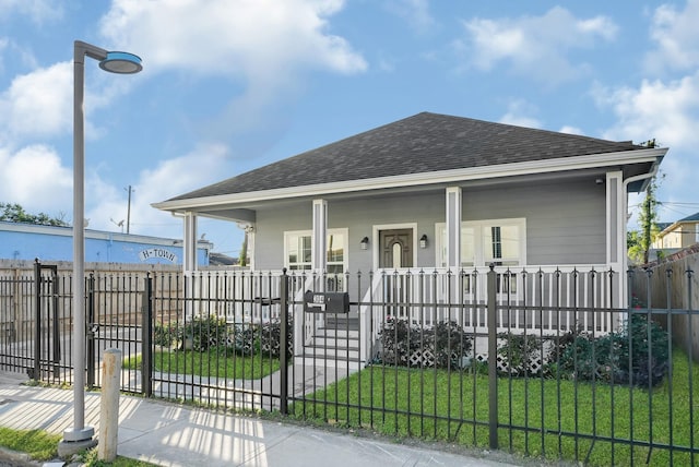 bungalow-style house with a front yard and a porch