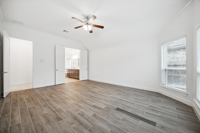 unfurnished living room featuring hardwood / wood-style flooring, ceiling fan, and ornamental molding