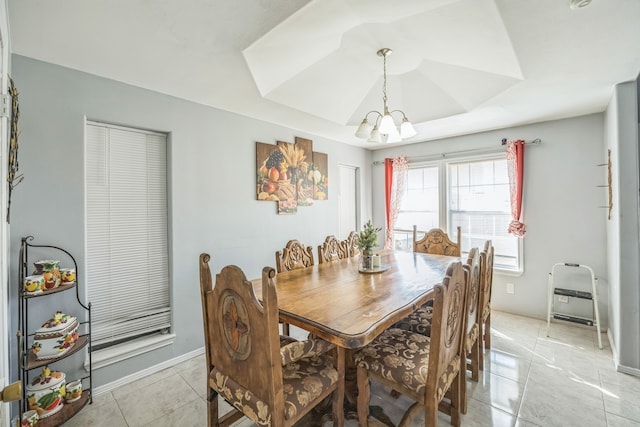 dining room with light tile patterned floors and a notable chandelier