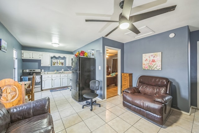 living room featuring light tile patterned floors and sink