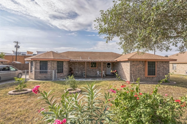 ranch-style home with a front lawn