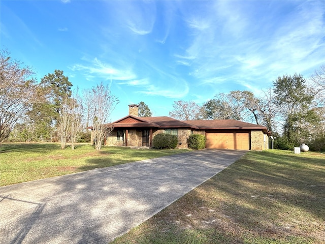 ranch-style home with a front yard and a garage