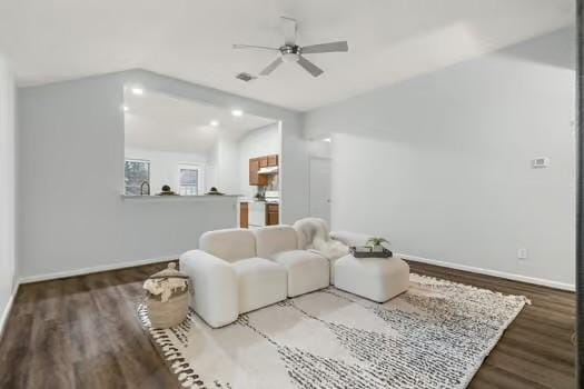 sitting room with ceiling fan and hardwood / wood-style flooring