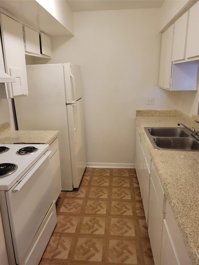 kitchen with white range with electric cooktop, white cabinetry, sink, and light parquet flooring