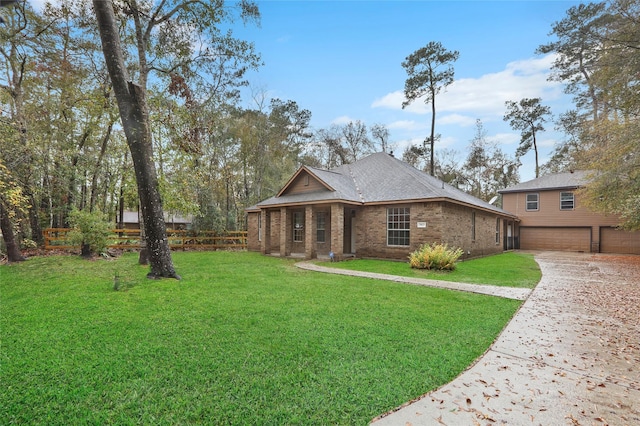 view of front of home featuring a front yard and a garage