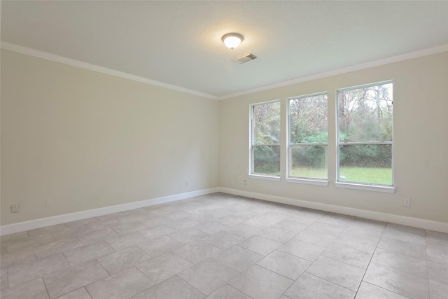 unfurnished room featuring crown molding and light tile patterned floors