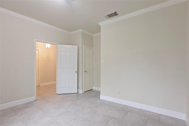 unfurnished room featuring crown molding