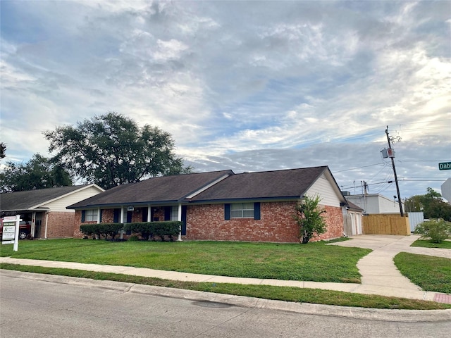 ranch-style home with a front yard