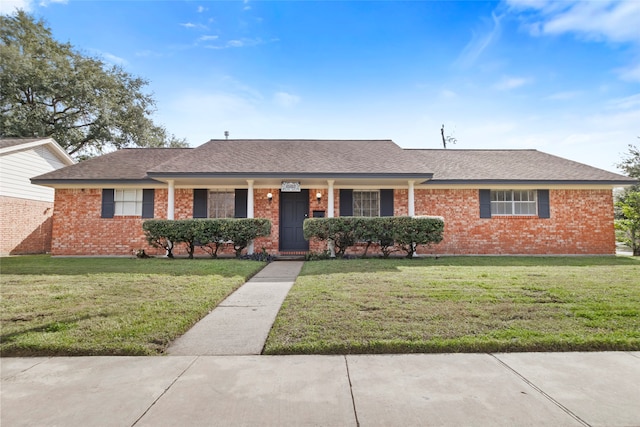 single story home featuring a front yard