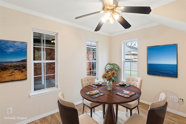 dining space featuring ceiling fan, crown molding, and light hardwood / wood-style flooring