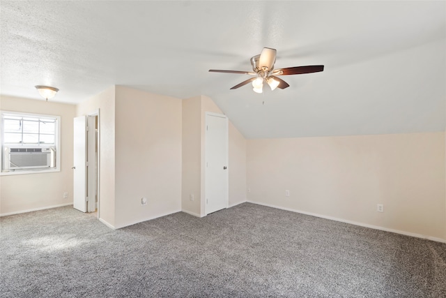 additional living space with ceiling fan, carpet flooring, lofted ceiling, and cooling unit