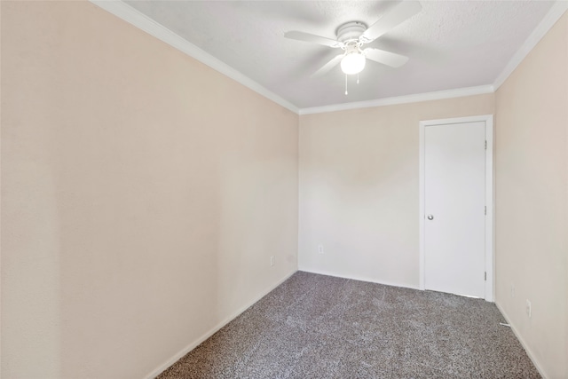 empty room featuring ceiling fan, a textured ceiling, ornamental molding, and carpet flooring