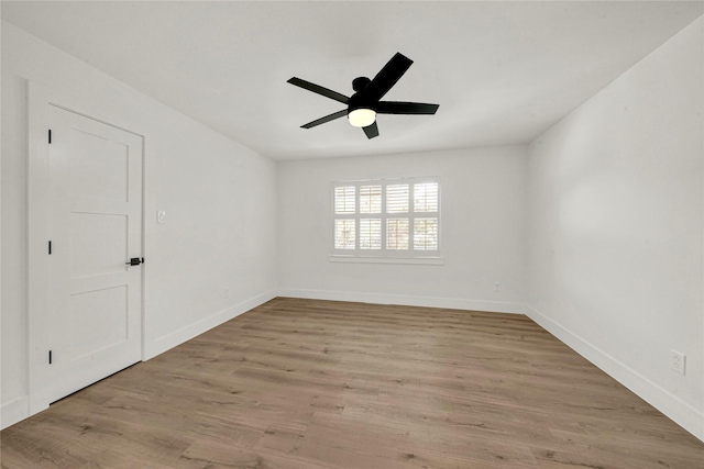 empty room with light wood-type flooring and ceiling fan