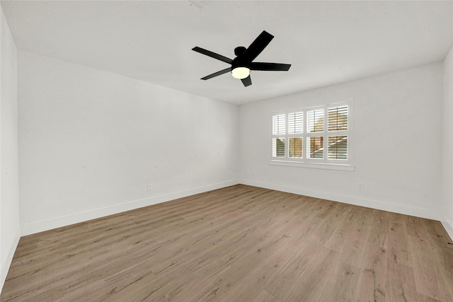 spare room with ceiling fan and light hardwood / wood-style floors