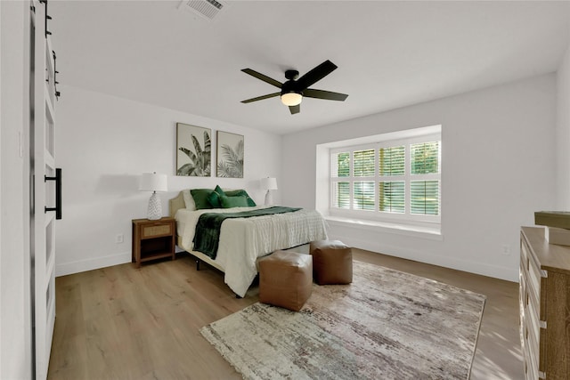 bedroom featuring light wood-type flooring and ceiling fan