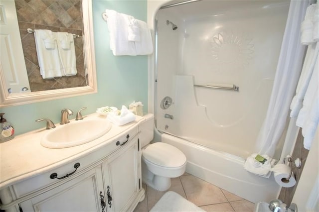 full bathroom featuring tile patterned flooring, shower / bath combo, toilet, and vanity