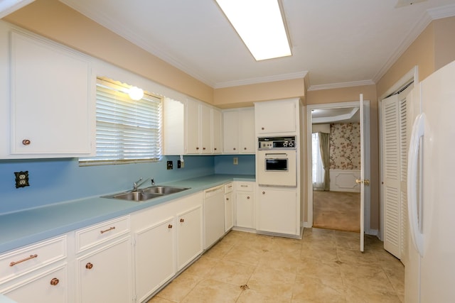 kitchen featuring white cabinetry, sink, crown molding, and white appliances