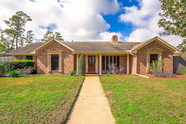 single story home with a front lawn