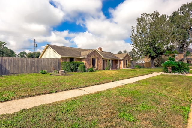 ranch-style home featuring a front lawn