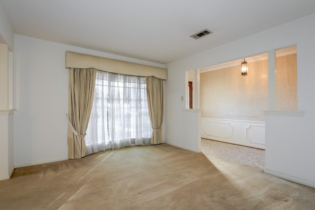 unfurnished room with light colored carpet